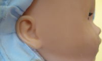 Ear of a baby doll