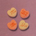 Conversation hearts showing one in alien language.