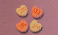 Conversation hearts showing one in alien language.