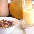 Granola, orange juice, and squash. Part of a complete breakfast.